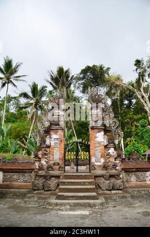 Bali temple gate - Pura Tirta Empul. Holy spring water in temple pura Tirtha Empul in Tampak, one of Bali`s most important temples, Indonesia Stock Photo